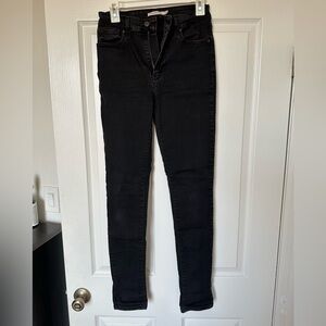 Worn black Levi skinny jeans